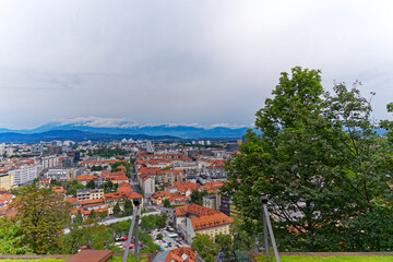 Aerial view of City of Ljubljana seen from Sance castle hill with mountain panorama in the...