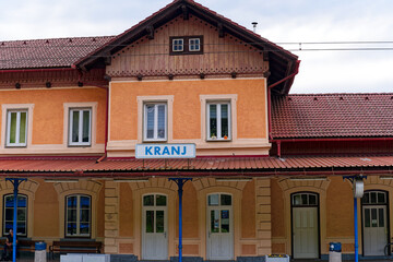 Scenic close up view of sign at railway station of Slovenian City of Kranj on a cloudy summer day. Photo taken August 9th, 2023, Kranj, Slovenia.
