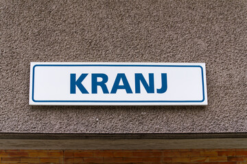 Scenic close up view of sign at railway station of City of Kranj on a cloudy summer day. Photo taken August 9th, 2023, Kranj, Slovenia.