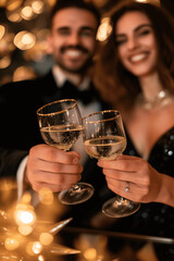 Smiling Couple Clinking Champagne Glasses