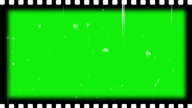 Film frame texture with sprocket hole on green screen with grain, film dirt, dust, hair, leaks and scratches. Old Film reel strip rolling overlay. 4k resolution free video download