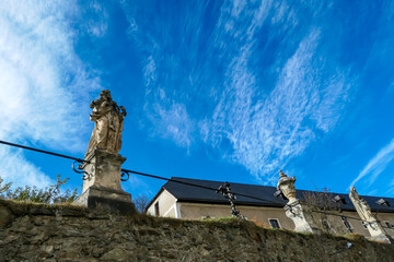 Sculpture against blue sky at Benedictine monastery Saint Lambrecht Abbey in nature reserve...