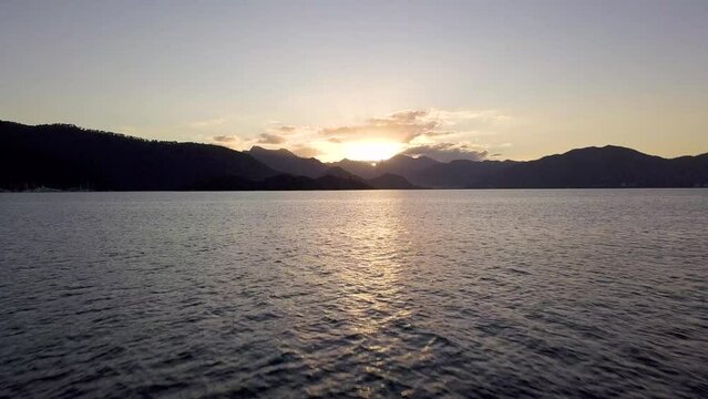 Spectacular Sunset Serenity: Close-Up Drone Video Over Fethiye's Turquoise Waters
