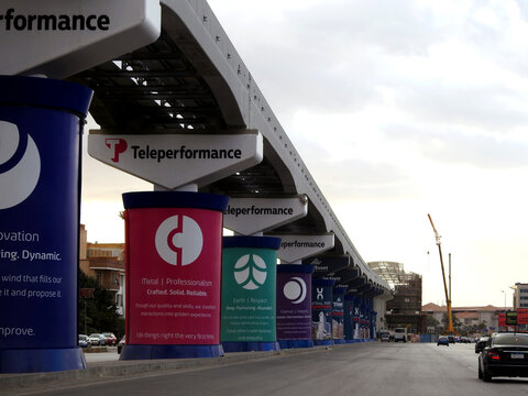Cairo, Egypt, January 26 2024: Teleperformance advertisement on Cairo monorail columns, advertisements banners of advertising campaigns and services on monorail columns