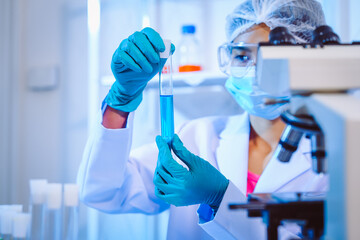 Female scientist diligently conducts virus blood lab tests, contributing to critical research and advancements in the field of virology.