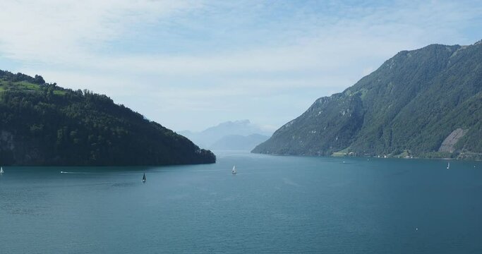 Lucerne in Swiss.View to the Lake of the four forested settlements  from Urnersee, south of Brunnen. Passage entre Treib and slopes of B&auml;rfallen and Grat with the Pilatus on Western horizon