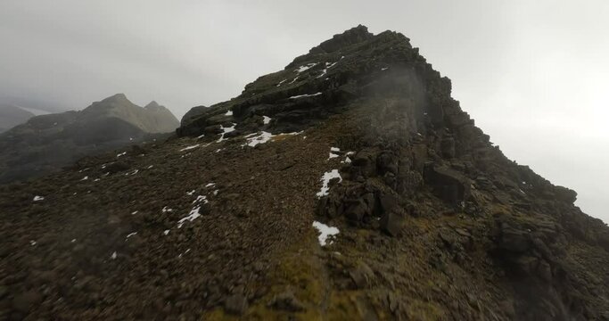Flying to the summit of Sgurr nan Eag located in the Cuillin mountains on the Isle of Skye, Scotland.
