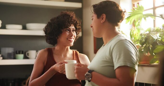 Couple, lgbtq and drinking coffee at home, conversation and bonding or security in relationship. Lesbians, people and communication on weekend in kitchen, tea and care in partnership and hot beverage