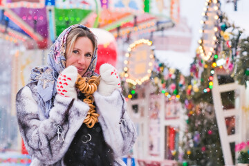 A woman in a Russian folk headscarf on her head in the Moscow