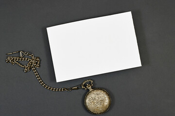 Wedding invitation card mockup and Antique silver pocket watch  on gray background. Blank card...