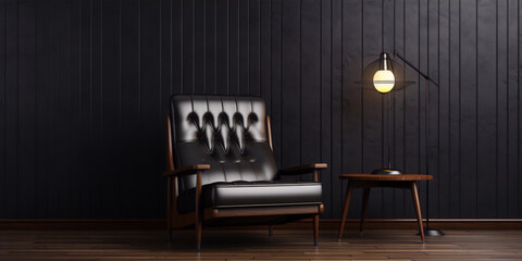 Black leather armchair and wooden table with lamp in dark wood paneled room