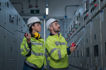 engineer working on the checking status switchgear electrical energy distribution substation