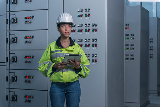 engineer working on the checking status switchgear electrical energy distribution substation