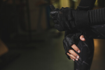 A beautiful female taekwondo fighter is preparing for the Olympics in the gym