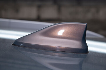 Shark fin car antenna. The radio antenna on the roof of the car.