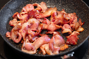 Frying pan full of crispy bacon