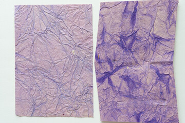 two rag textured paper pieces in dull watercolor purple