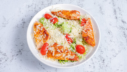 Caesar salad bowl top view isolated