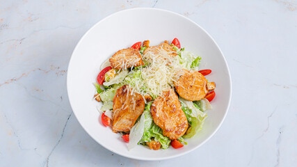 Caesar salad bowl top view isolated
