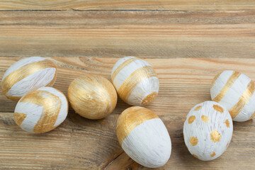 Happy Easter. Painted eggs on wooden table. Top view.