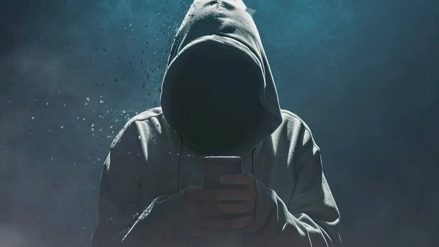 In the realm of cybersecurity, an ominous figure clad in a hoodie embodies the archetype of a computer hacker