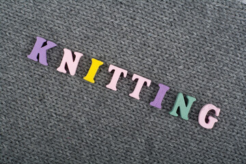 Knitting. Knitted Fabric Texture. Word composed from ABC alphabet letters.