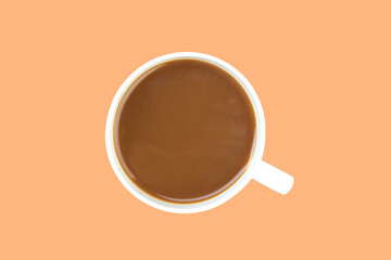 A cup of ground coffee isolated on a orange background. top view.