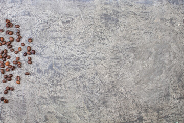 Coffee beans on a gray concrete background. Top view. Copy space. Design element.