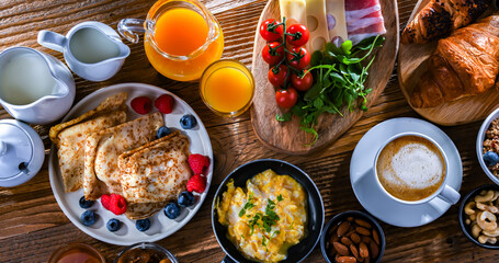 Breakfast served with coffee, eggs, cereals nd croissants
