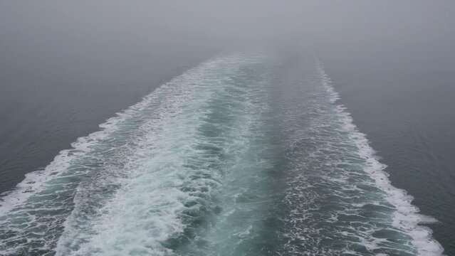 Wake behind a BC Ferries vessel in the Pacific Ocean on its way to Vancouver Island in British Columbia, Canada