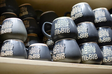 souvenir ceramic cups in a gift shop. translation: Lvov