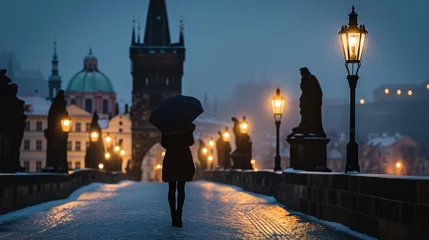 Poster Silhouette of a girl in Charles bridge with historic buildings in the city of Prague, Czech Republic in Europe. © Joyce