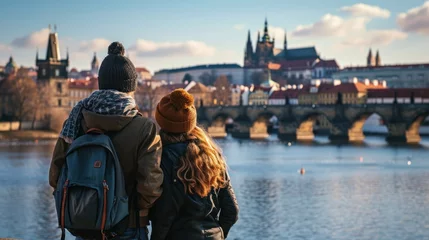 Cercles muraux Pont Charles Back view of a young couple watching a fantastic view of bridges over Vltava River with historic buildings in the city of Prague,