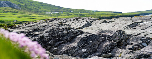 Rough and rocky shore along famous Ring of Kerry route. Rugged coast of on Iveragh Peninsula,...