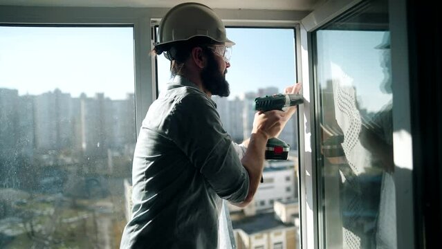 Builder installs plastic windows and furniture	