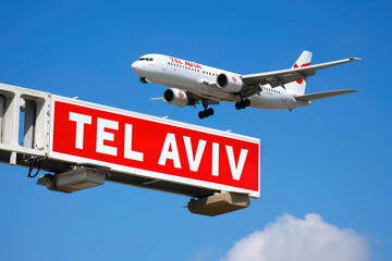 Airplane landing with TEL AVIV sign in the foreground, arriving in Israel, Ben Gurion airport	