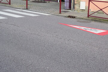 pedestrian crossing with a warnign sign