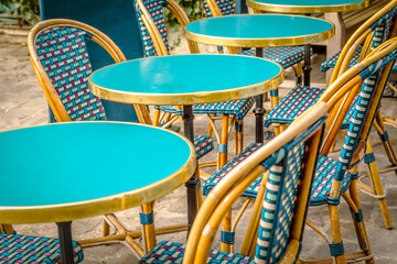Typical table and chairs in the streets of Paris, France