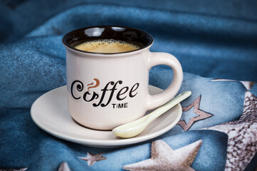 cup of coffee on blue background and coffee time text