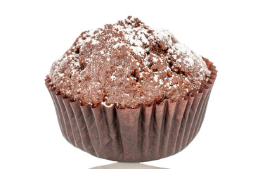 One chocolate muffin, macro, isolated on white background.