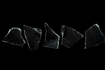 Glass shards isolated on a black background.