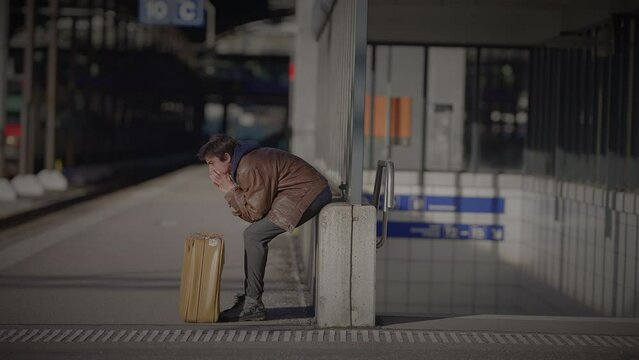 Mother Waiting for Son at Train Station Checking the Time to Consult a Watch