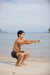 Muscular Asian Athlete Running on the Beach, Exuding Strength and Determination in a Healthy Lifestyle Portrait with a Stunning Sunset Background