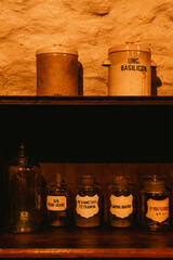 Multiple pharmaceutical liquids on a shelf in an old pharmacy basement - 738863044