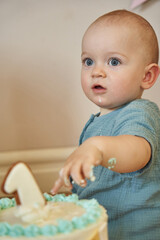 The birthday boy relishes every bite of his cake as he turns one.