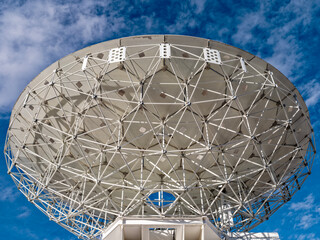 The back of a radio telescope dish aimed at the sky