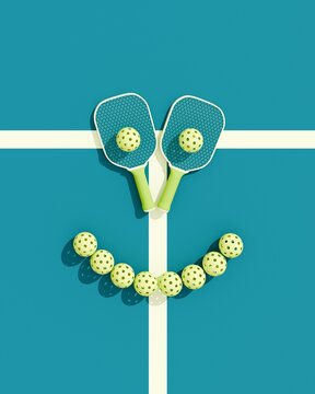 Pickleball sport equipments. Two rackets and balls on court, laid out in the form of a cheerful smiley face. Top view. 3d illustration, render.