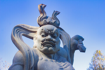 Intimidating warrior statue in the Buddhist temple Chen Tien, or 'templo budista' in Portuguese, in...