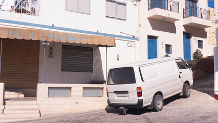classic van parked on a narrow European street on the island