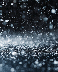 Falling snow flakes isolated on black background